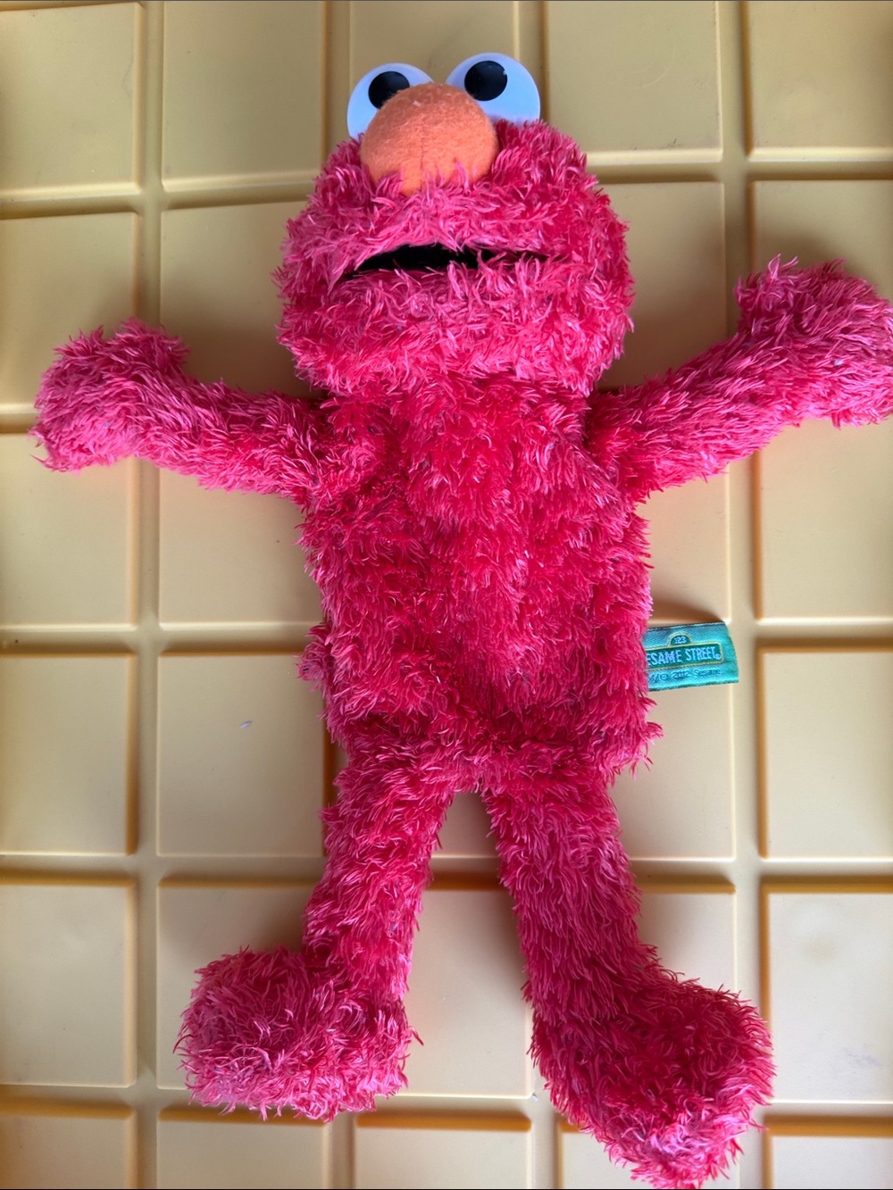 Sesame Street Pink Elmo Plush Puppet - Bright Pink with Orange Nose